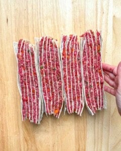 tortilla layered with beef facing up, showing the layers.