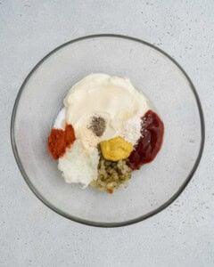Ingredients for Big Mac sauce placed in a bowl.