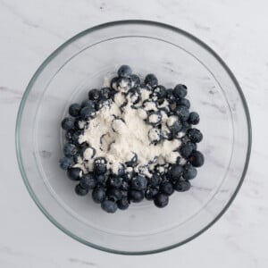flour added over blueberries.