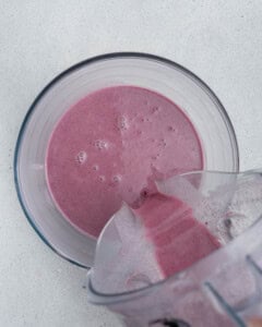 blueberry mixture being transferred into a bowl