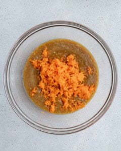 grated carrots added over the egg and banana mixture.