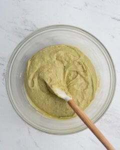 pistachio batter mixed with flour in a bowl.
