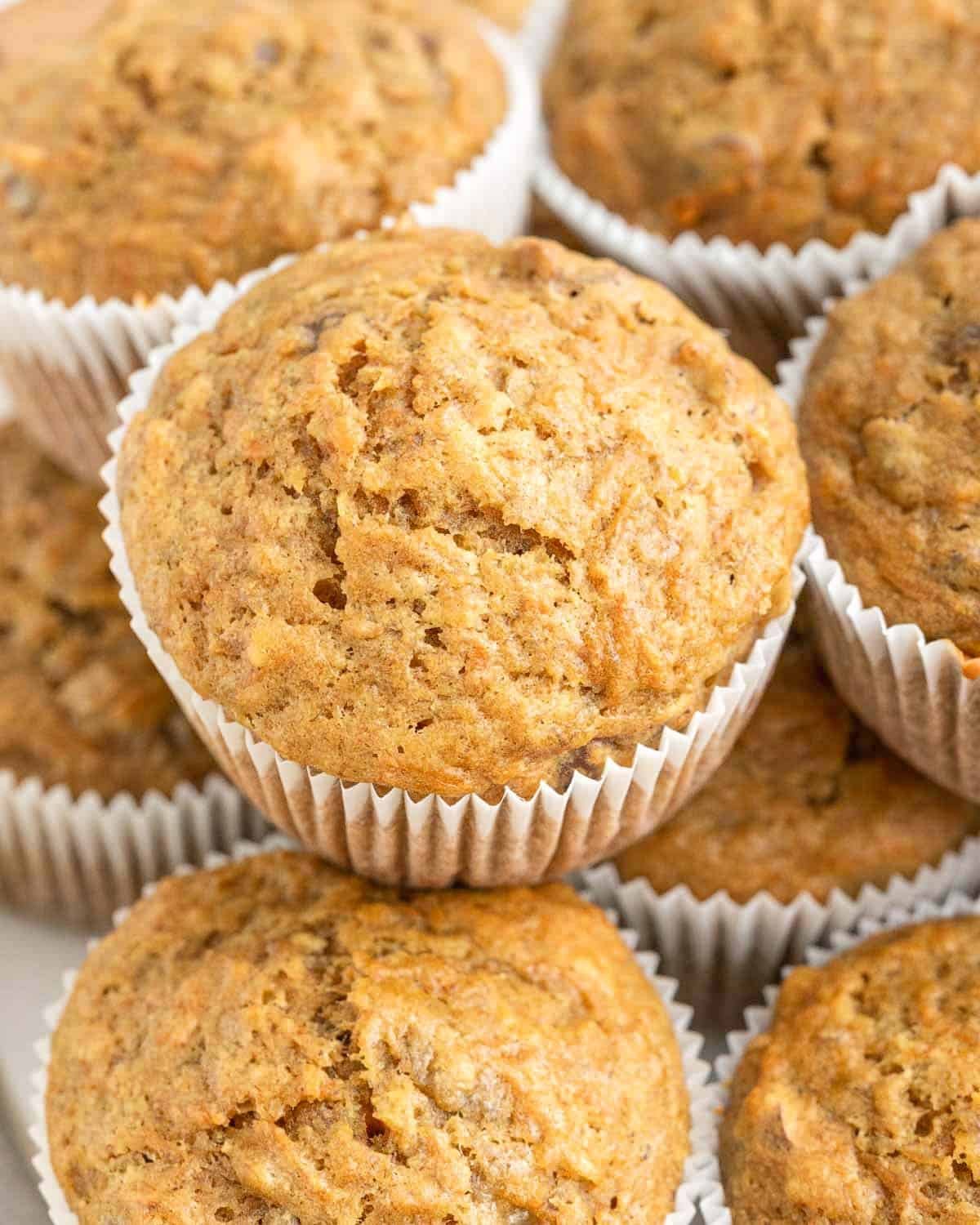 carrot and banana muffins stacked over each other.
