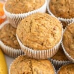 Carrot banana muffins stacked over each other.