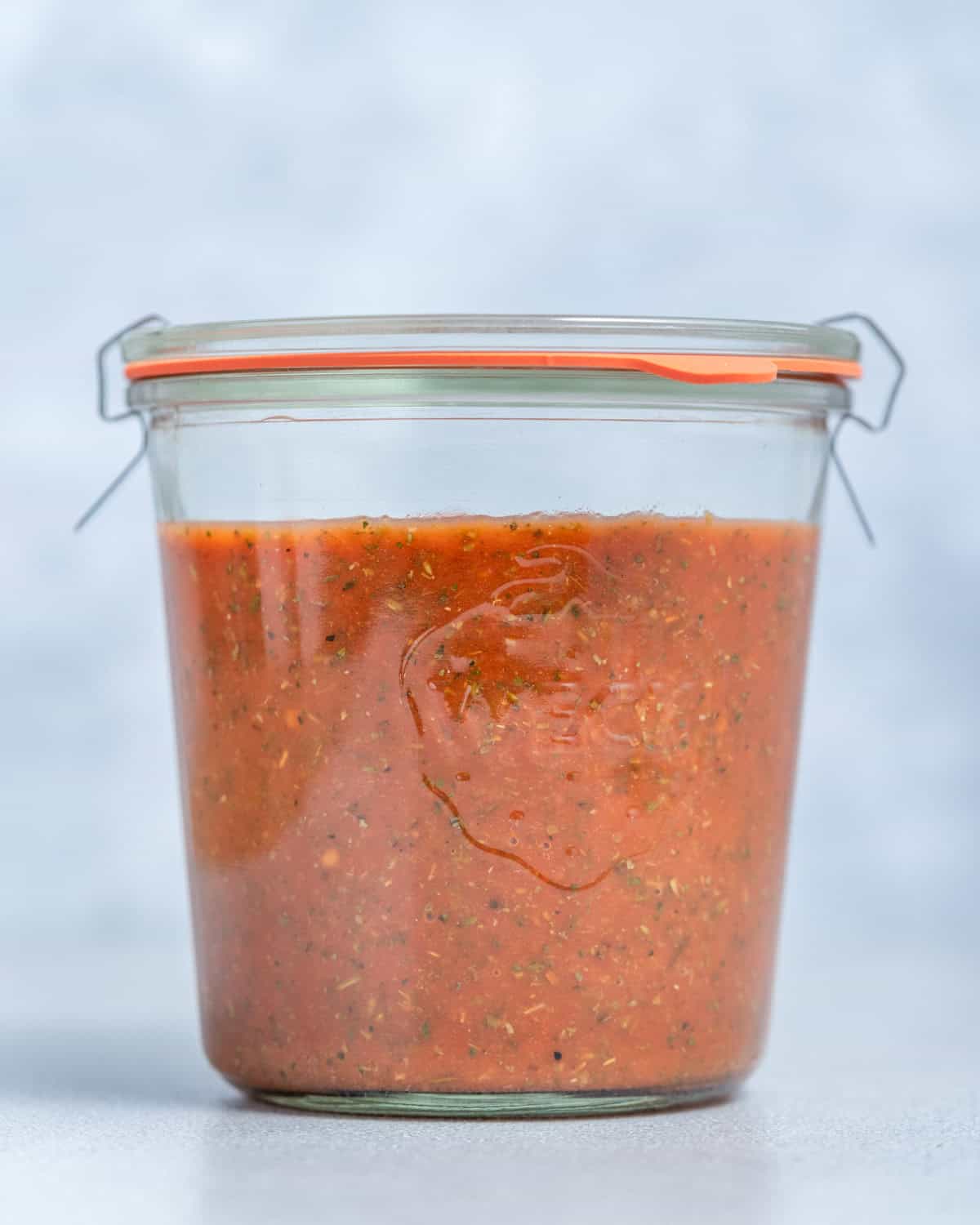 A jar of homemaade pizza sauce.