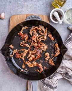 steak slices cooked in a skillet.