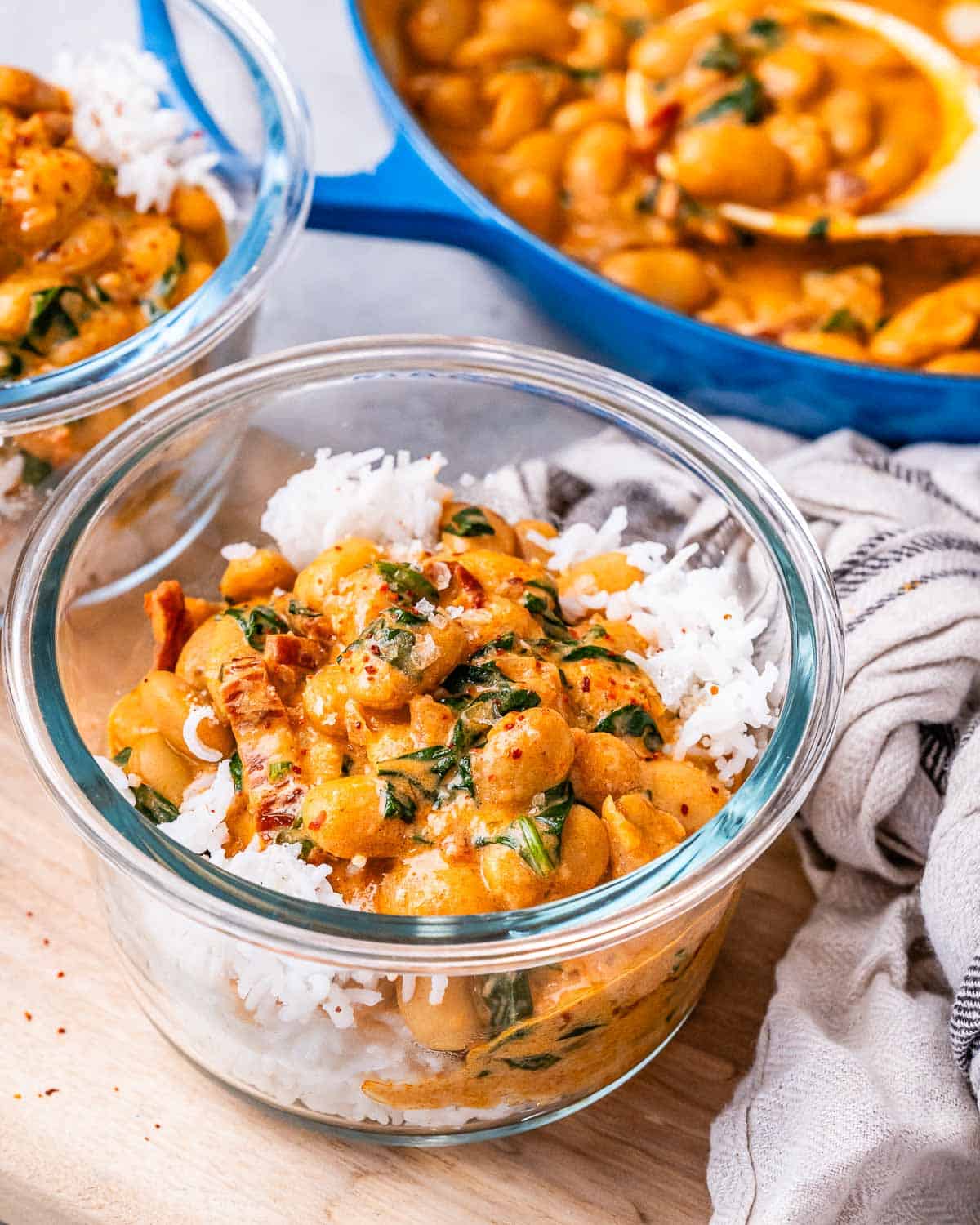 a bowl of rice topped with marry me butter beans.