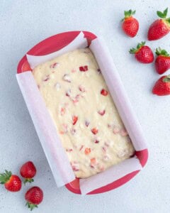 strawberry pound cake batter added into a silicone pan.