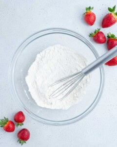 flour, baking powder, and salt added to a bowl.