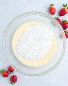 flour added over the egg and yogurt mixture.