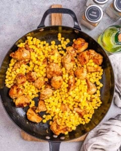 corn added over the seared chicken bites.