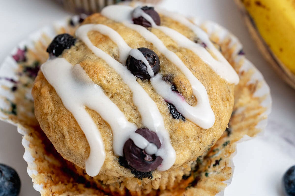 blueberry muffin topped with glaze.