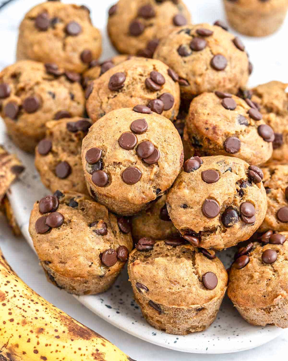 mini chocolate chip muffins placed on a plate.