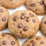 chocolate chip cookies made with almond butter on a flat surface.