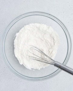 flour mixture being mixed in a bowl.