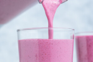 smoothie being poured into a cup.