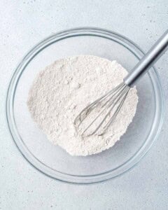 oat flour, salt, and baking powder, added to a bowl.