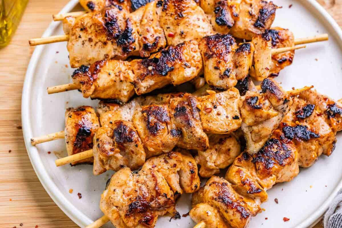 grilled chicken skewers on a plate.
