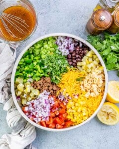 prepped veggies for pasta salad in a bowl.