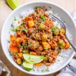 Mexican picadillo served over rice in a bowl.