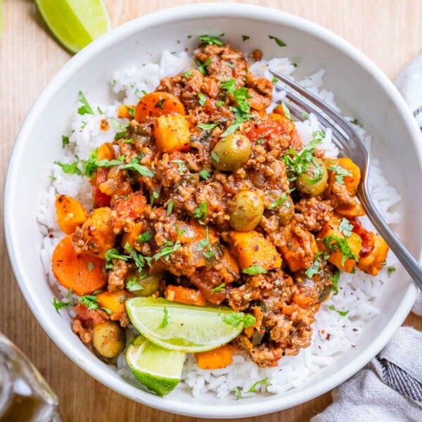 Mexican picadillo served over rice in a bowl.