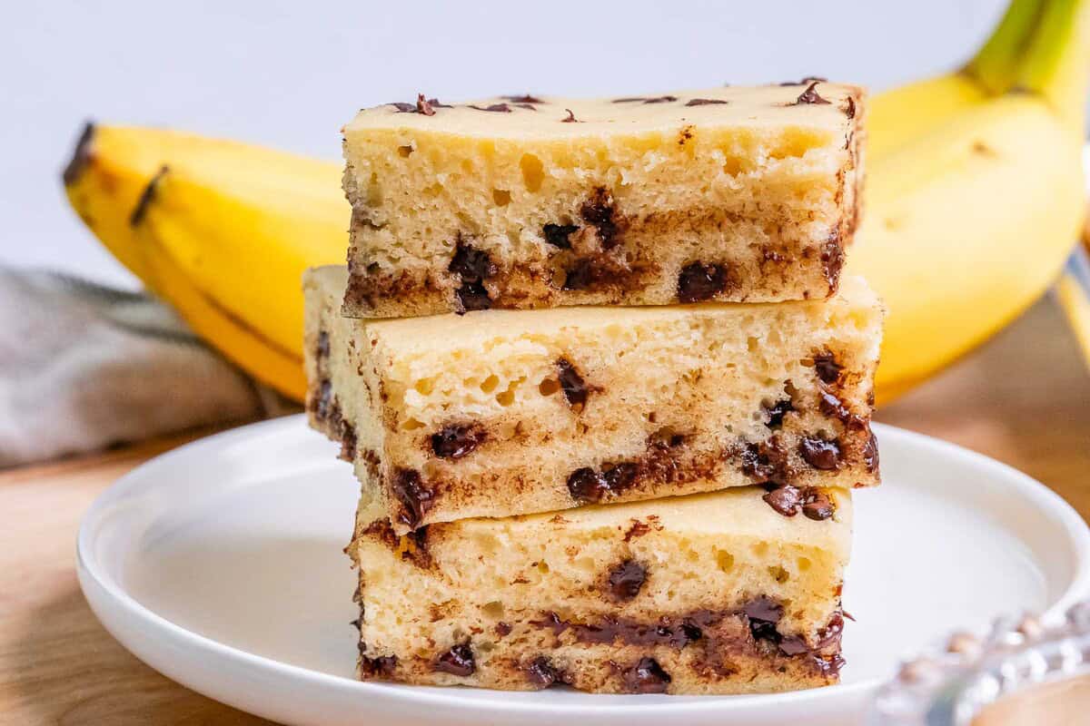3 stacks of sheet pan pancake squares on a plate.