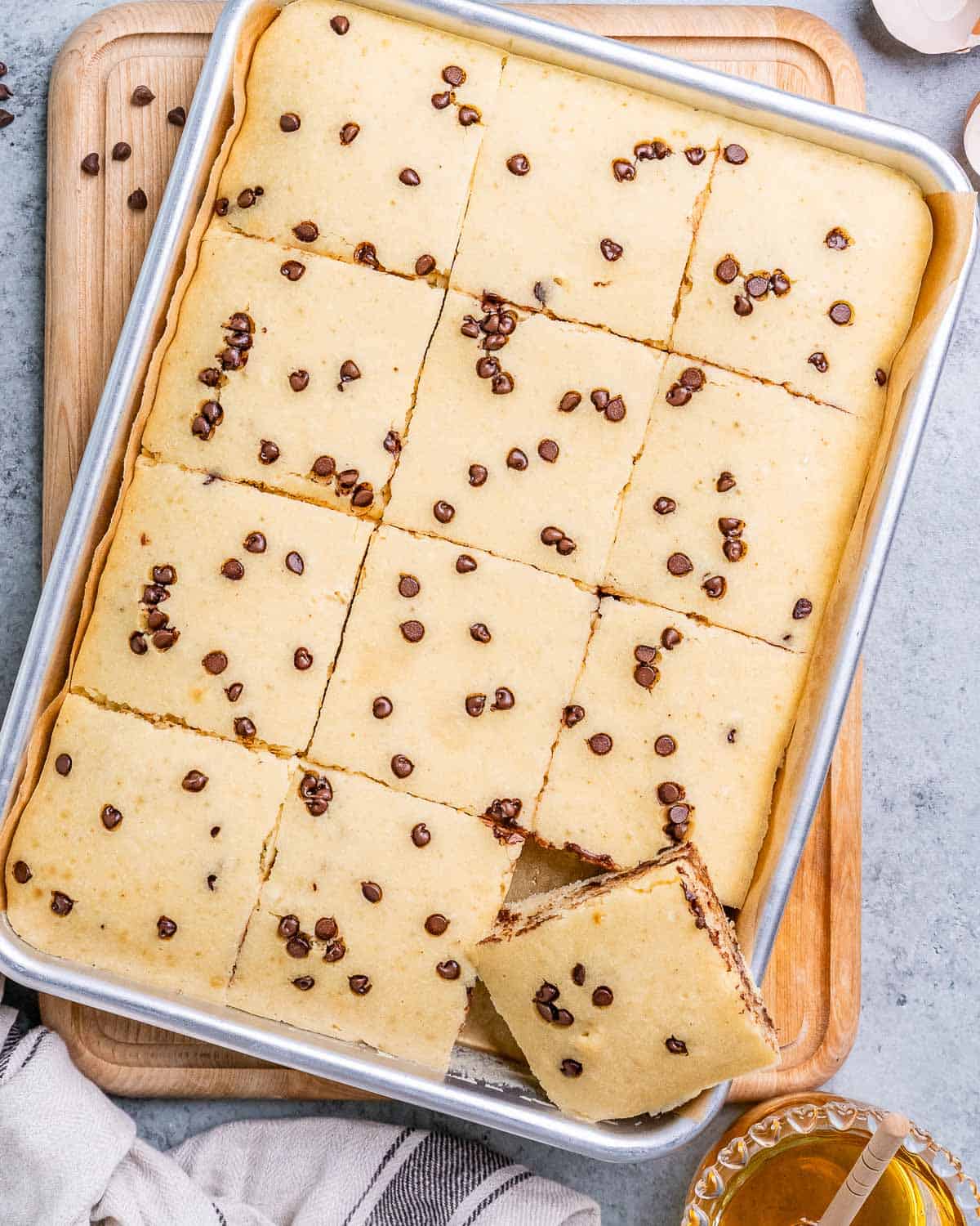 Chocolate chip sheet pan pancakes cut into squares.