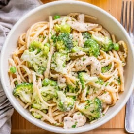 chicken tetrazzini made with chicken, peas, broccoli with pasta in a bowl.