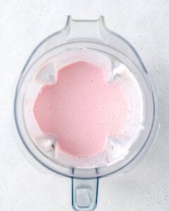 blended strawberry smoothie in a blender.