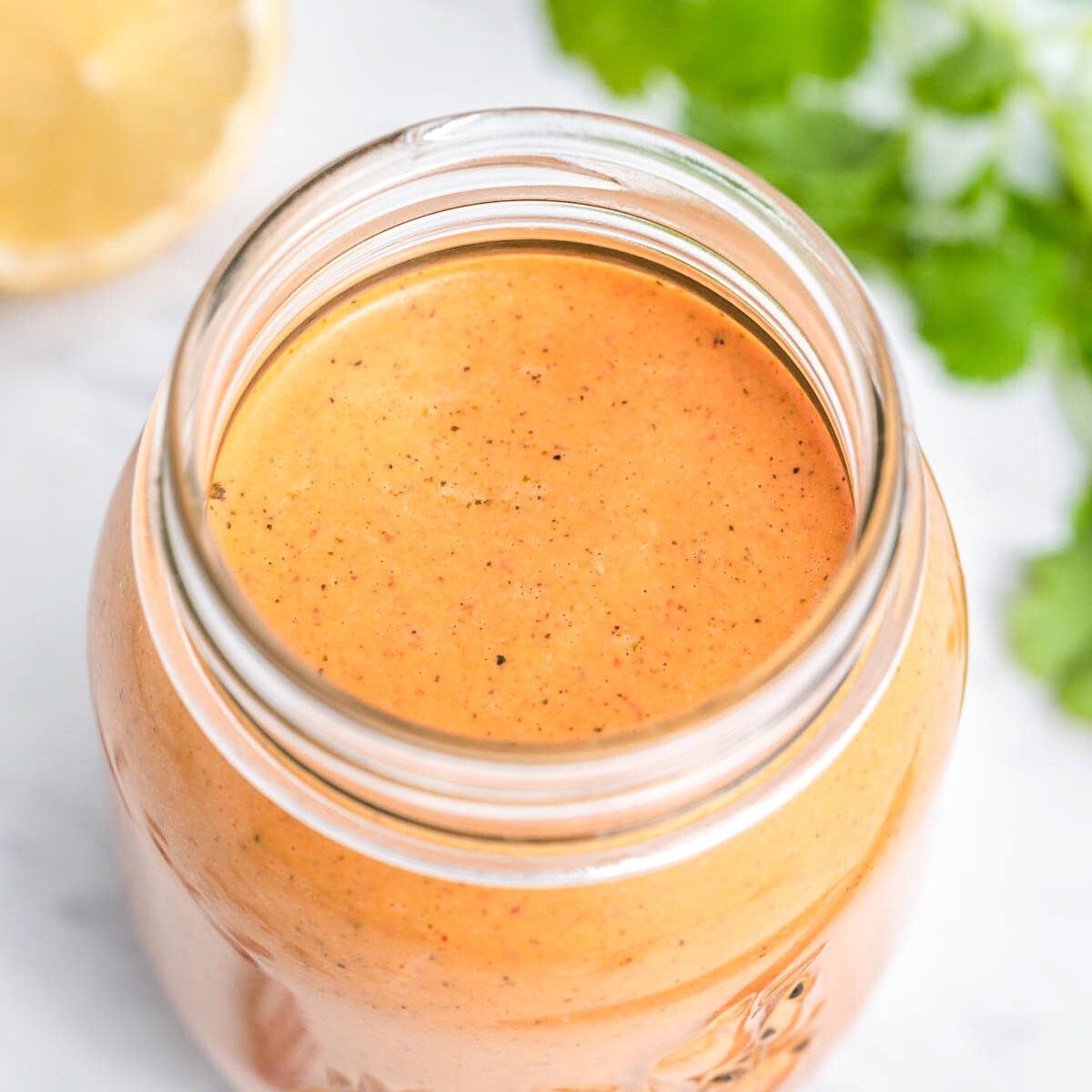 a jar filled with peri peri sauce.