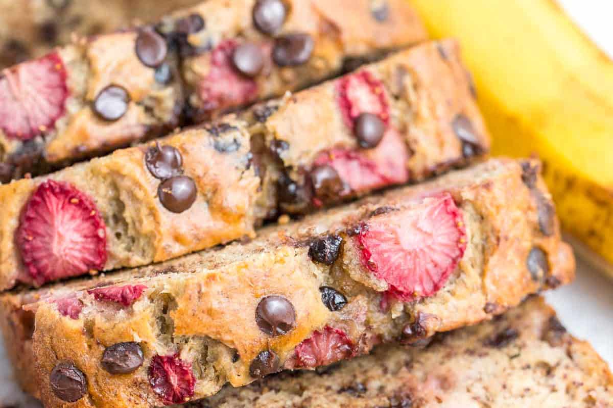 sliced strawberry banana bread with chocolate chips.