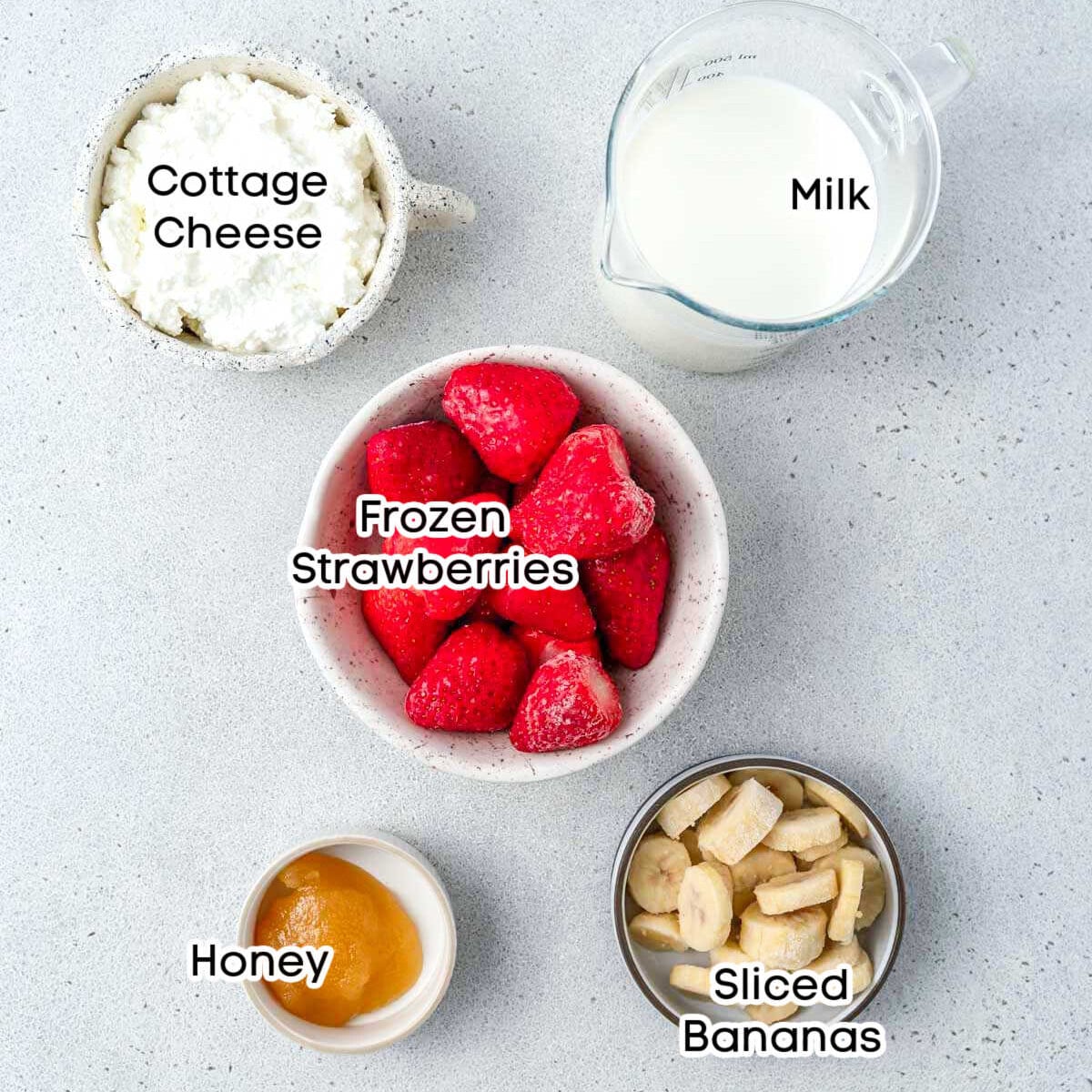 ingredients to make a cottage cheese strawberry smoothie.