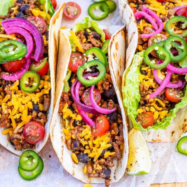 Beef tacos on a cutting board.