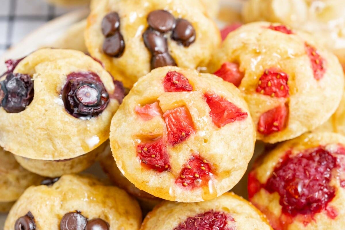 mini muffins in a bowl stacked over each other.