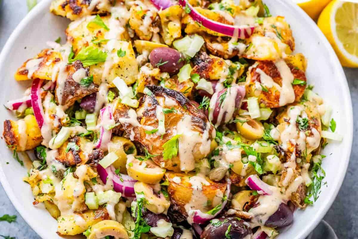 smashed potato salad in a bowl.