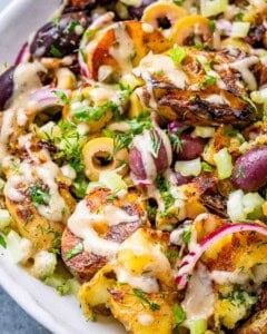 smashed potato salad in a bowl.