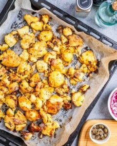 roasted smashed potatoes on a pan.