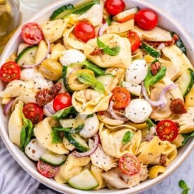 a bowl filled with tortellini salad.