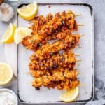 baked chicken skewers on a sheet pan.
