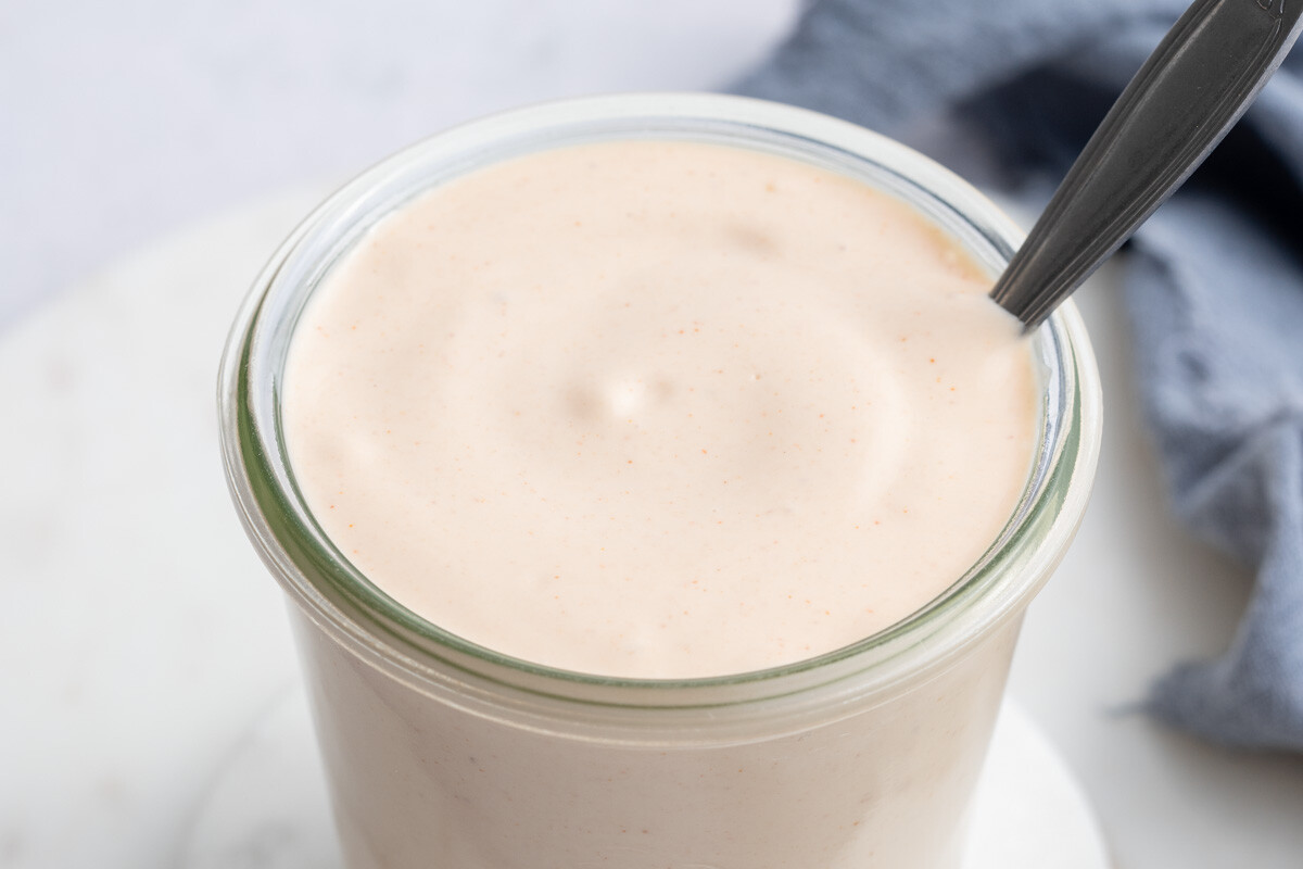 yum yum sauce in a jar with spoon in the jar.