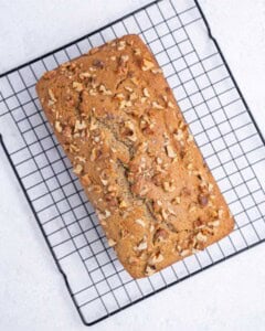 applesauce bread placed on a wire rack to cool.