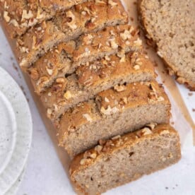 applesauce bread sliced on a flat board.
