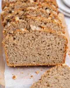 sliced applesauce bread on a cutting board.