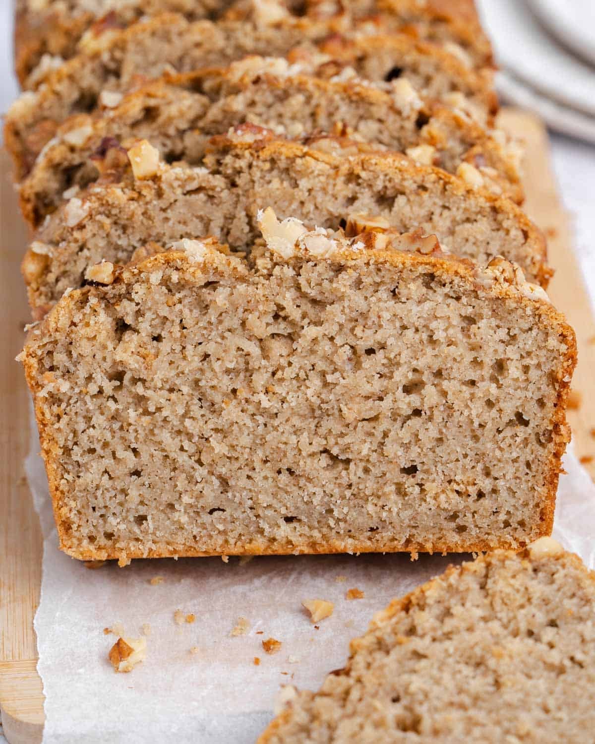 sliced applesauce bread on a cutting board.