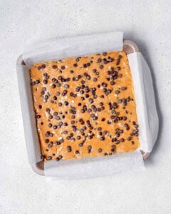 dough spread over in a pan to be baked.