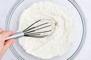mixing flour in a bowl.