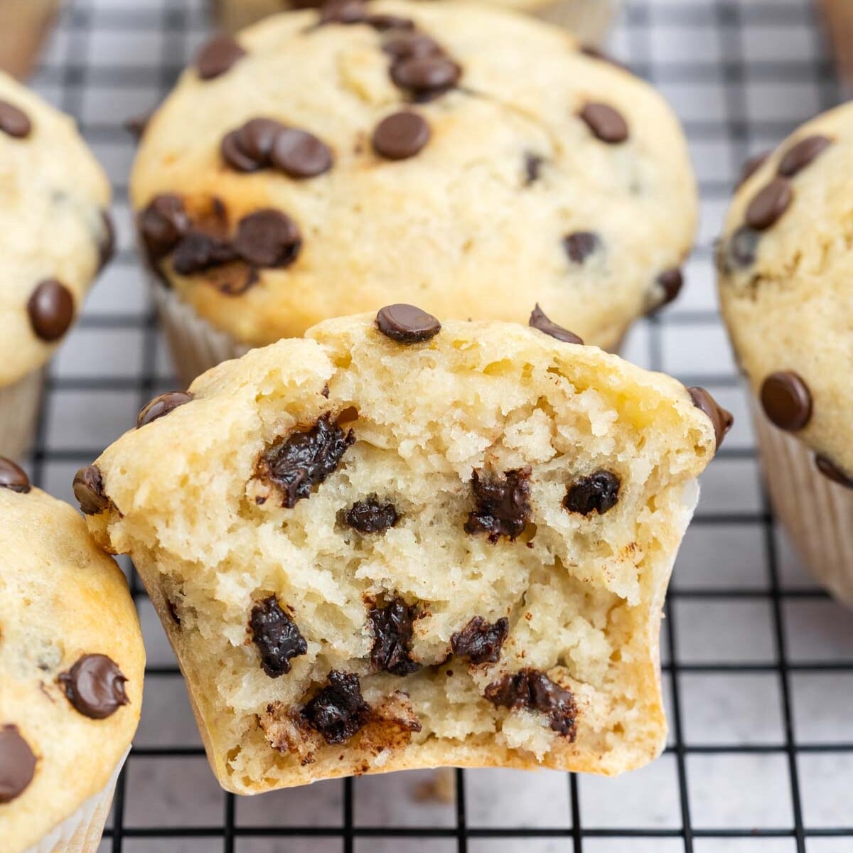 cottage cheese banana muffin sliced in half with melted chocolate morsels. inside.