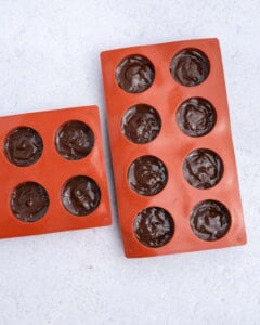 melted chocolate added over the peanut butter base in a silicone mold.