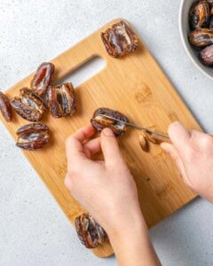 removing the seeds from the date.