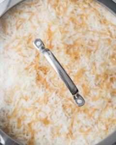 lid covering pan to cook rice.